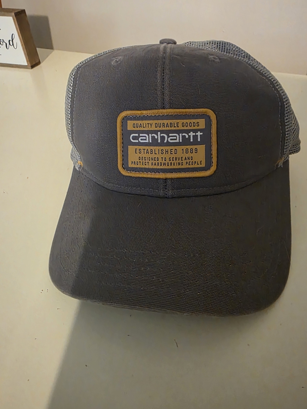 Carhartt Dark Gray Trucker Cap with Yellow Logo Patch